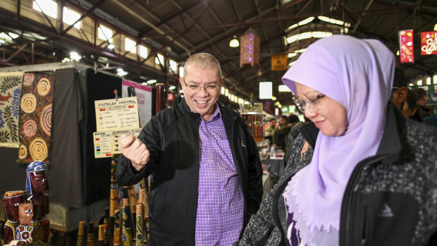 Malaysian Foreign Minister Saifuddin Abdullah and his wife Norlin Shamsul Bahri visit Queen Victoria Market on Sunday.