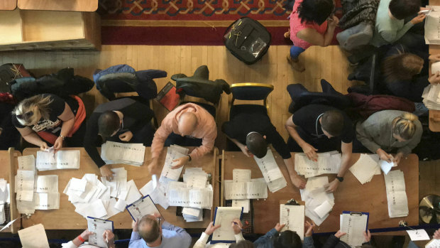 Counting in the British local government elections begins at Belfast City Hall, Northern Ireland, on Friday.