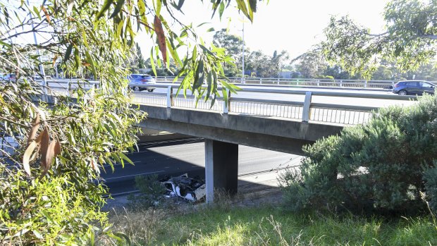 The overpass on the Monash Freeway where a man's white sedan rolled on Monday night. 