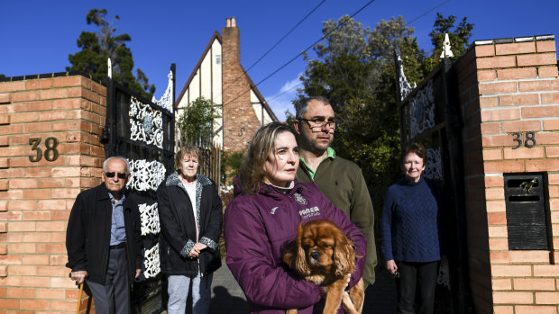 Irene and Frank Pothitos (centre), and Irene's parents Andrew and Linda in front of their house designed by Esme Johnston. 