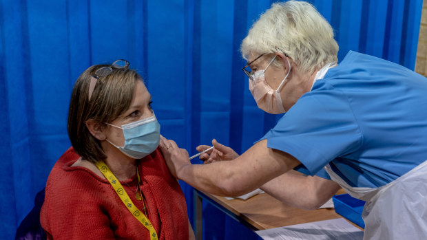 A nurse in Wales receives the COVID-19 vaccine: The shape, speed and logistical back-up for the UK vaccine rollout puts the country ahead of Europe.