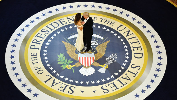 President Donald Trump and first lady Melania Trump dance during one of the many inauguration day events in Washington on January 20, 2017.