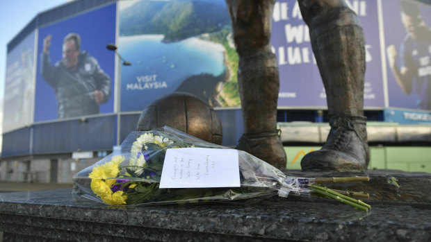 Flowers left on the statue of former Cardiff City soccer player Frederick Charles Keenor following the disappearance of new signing Emiliano Sala.