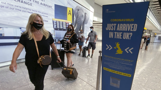 Passengers arrive at Heathrow Airport.
