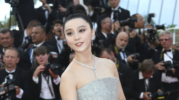 Fan Bingbing poses for photographers upon arrival at the opening ceremony of the 71st international film festival, Cannes.