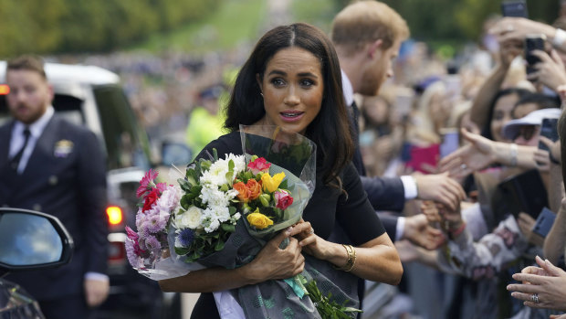 Meghan, the Duchess of Sussex, with mourners.