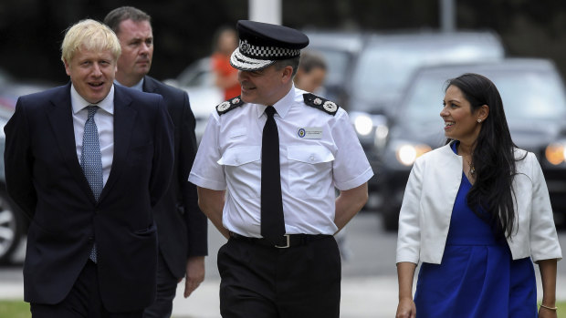 Britain's Prime Minister Boris Johnson and Home Secretary Priti Patel meet with Chief Constable of West Midlands Police Dave Thompson, centre, in Birmingham.
