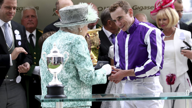 Marquee man: Queen Elizabeth II presents a medal to jockey Ryan Moore after his Diamond Jubilee victory.