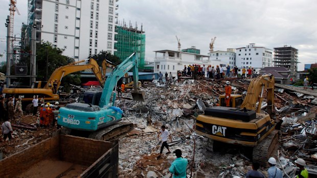 Rescue workers were using saws to cut steel beams and excavators to move piles of rubble of the collapsed building. 