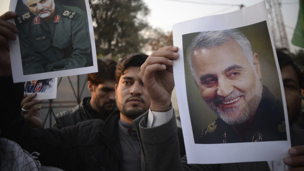 Pakistanis demonstrate over the US air strike in Iraq that killed Iranian Qassem Soleimani, in Peshawar, Pakistan, on Friday.