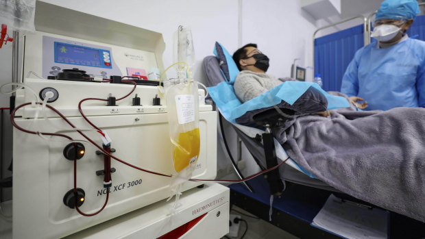 Dr Kong Yuefeng, a recovered COVID-19 patient who has passed his 14-day quarantine, donates plasma in the blood centre in Wuhan. 