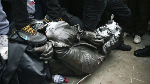 Protesters pull down a statue of slave trader Edward Colston during a Black Lives Matter protest rally in Bristol.