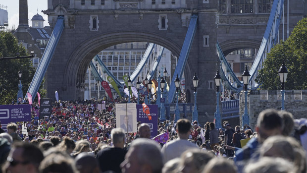 Runners cross the Tower Bridge for the London Marathon.