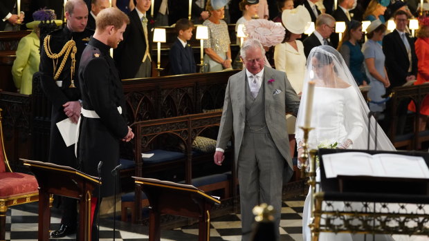 Meghan Markle accompanied by Prince Charles.