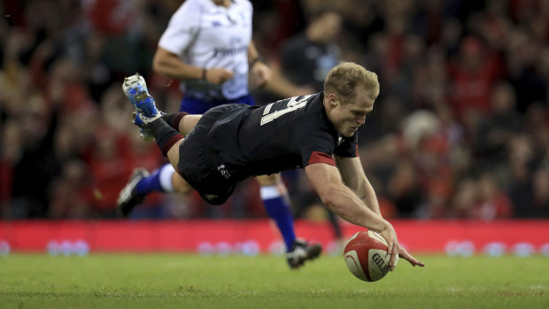 Welshman Aled Davies crosses for a try in their victory over Tonga.