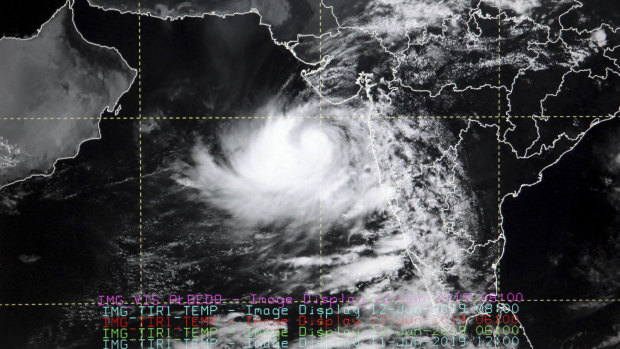 A computer screen shows a satellite image of Cyclone Vayu at a cyclone monitoring centre at the Indian Meteorological Department office in Delhi, India.