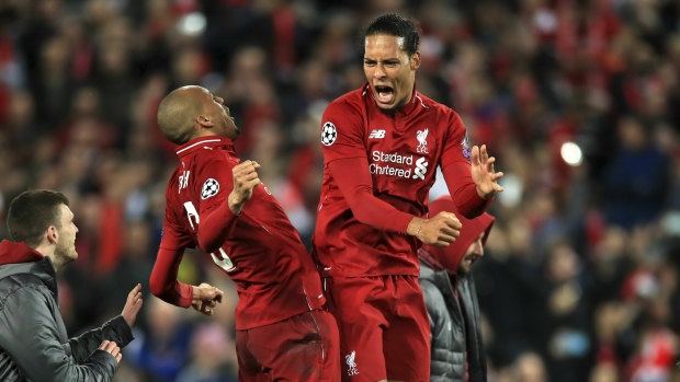 Fabinho and Virgil van Dijk celebrate Liverpool's comeback win.
