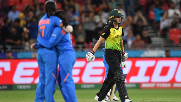 India celebrate the wicket of Meg Lanning in the Women's T20 World Cup opener. 