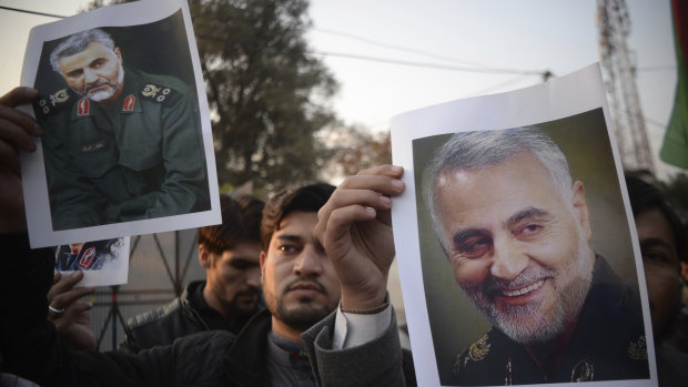 Pakistanis demonstrate over the US air strike in Iraq that killed Iranian Qassem Soleimani, in Peshawar, Pakistan.