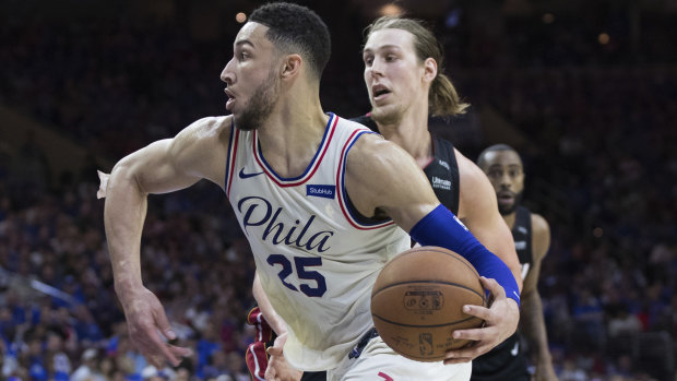 Ben Simmons drives to the basket past Miami's Kelly Olynyk.