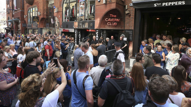 People queue outside the Cavern Club before McCartney's one-off gig.