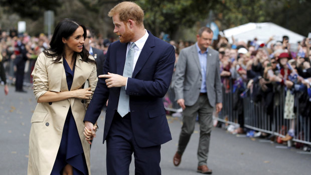 Loved-up: Meghan and Harry.