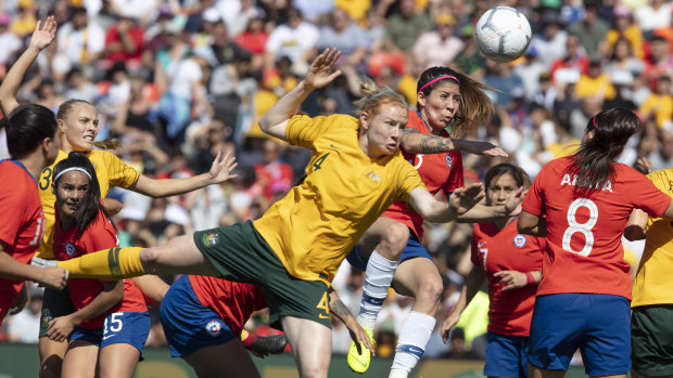 One-way traffic: Maria Jose Urrutia of Chile clears the ball during an onslaught from the Matildas.