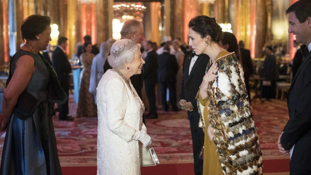 Queen Elizabeth greets a pregnant Jacinda Ardern at Buckingham Palace during  Commonwealth heads of government dinner in London in April.
