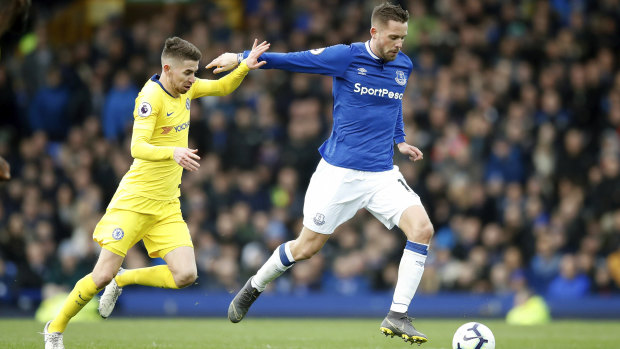 Chelsea's Jorginho gives chase to Everton's Gylfi Sigurdsson.
