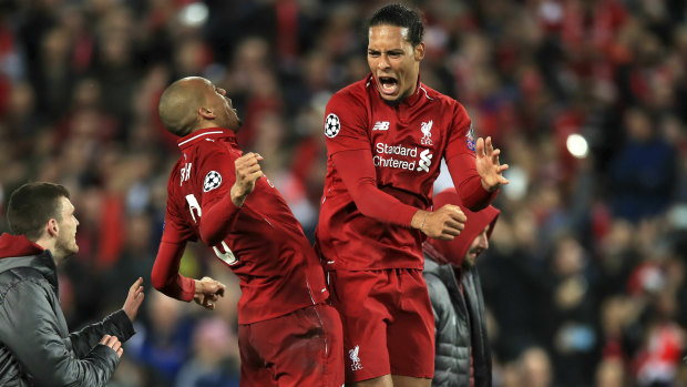 Fabinho and Virgil van Dijk celebrate Liverpool's comeback win.