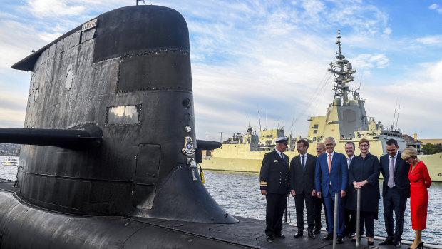 Prime Minister Malcolm Turnbull and ministers on a submarine at Garden Island during a visit by French President Emmanuel Macron earlier this year.