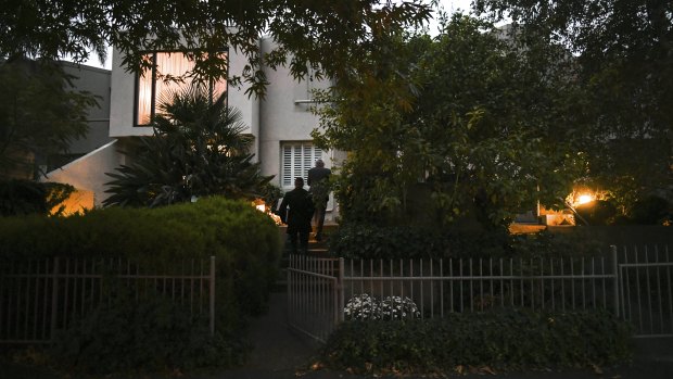 Police knock on doors on Well Sreet in Brighton on Sunday evening.