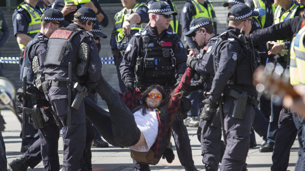 Police arrested about 36 protesters at a climate rally in Melbourne on Saturday afternoon.
