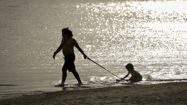 Fabio Matos de Freitas and his four-year-old son Taj enjoying a beautiful Spring day at St Kilda Beach. 
