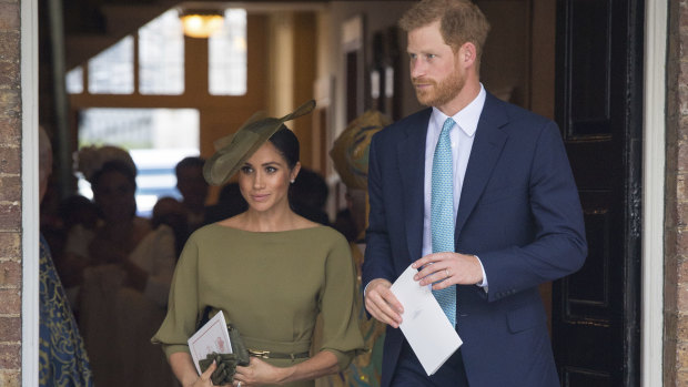 Prince Harry and Meghan, Duchess of Sussex, leave after the christening service.