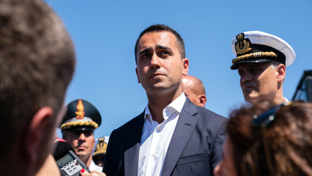Luigi Di Maio, Italy's deputy prime minister, speaks to the media as he visits the Morandi motorway bridge after it partially collapsed in Genoa, Italy.