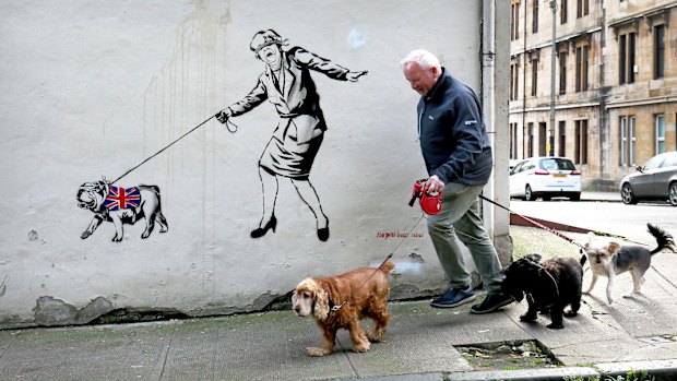 An artwork depicting Prime Minister Theresa May by street artist The Pink Bear Rebel is seen in the West End of Glasgow, Scotland. 