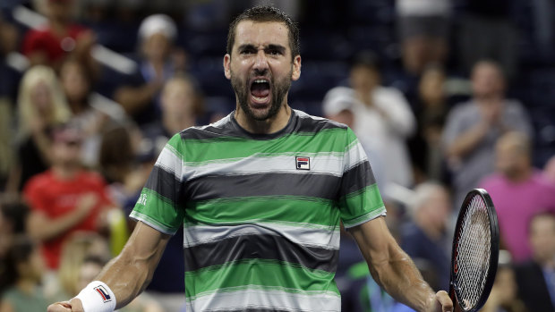 Triumph of will: Marin Cilic celebrates seeing off his young Australian challenger.