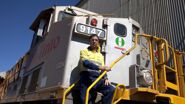 Rio Tinto iron ore managing director rail, port and core services Ivan Vella on one of the Autohaul locomotives.