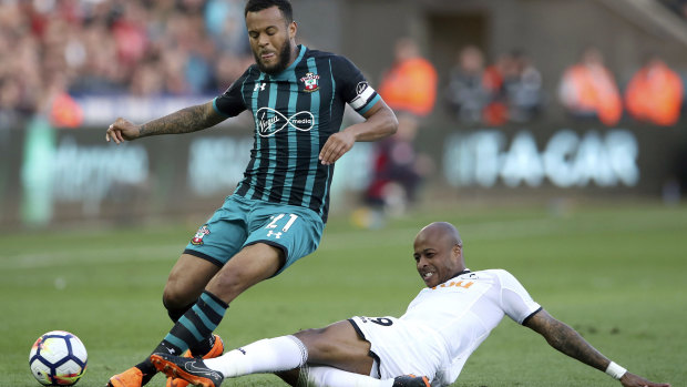 Tussle: Southampton's Ryan Bertrand, left, and Swansea City's Andre Ayew battle for the ball.