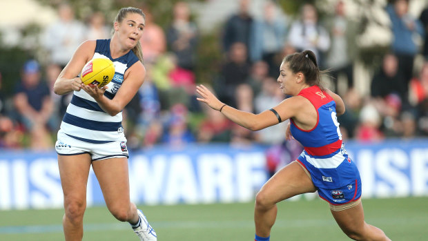 Geelong's Rebecca Webster feels the pressure from Bulldog Monique Conti.