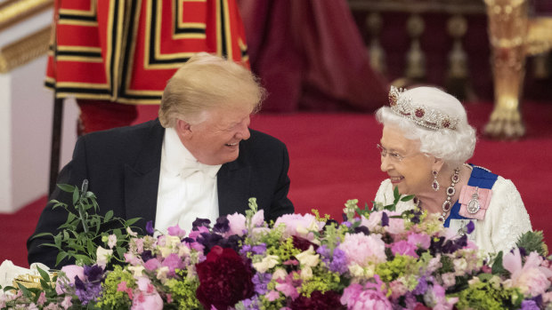 US President Donald Trump and the Queen laugh during a state banquet at Buckingham Palace.