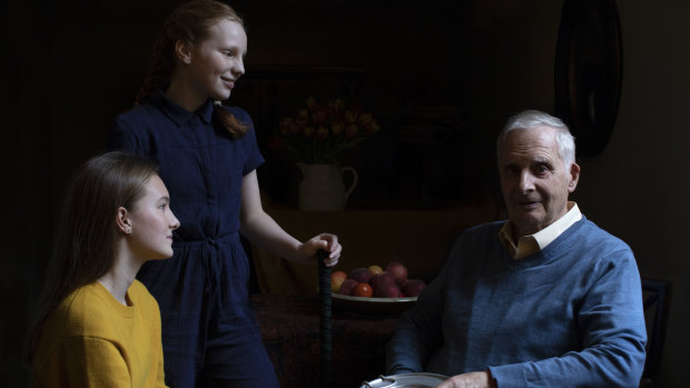 Steven Frank BEM, aged 84, originally from Amsterdam, who survived multiple concentration camps as a child, pictured alongside his granddaughters Maggie and Trixie Fleet, aged 15 and 13.