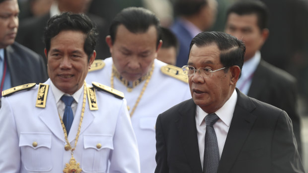 Cambodian Prime Minister Hun Sen, right, says his government has defeated an attempted coup.