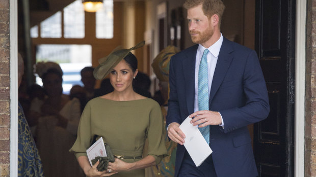 Harry and Meghan, Duchess of Sussex, leave after the christening service.