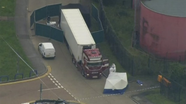 An aerial view as police forensic officers attend the scene after a truck was found to contain 39 dead bodies, in Thurrock, South England, on October 23.