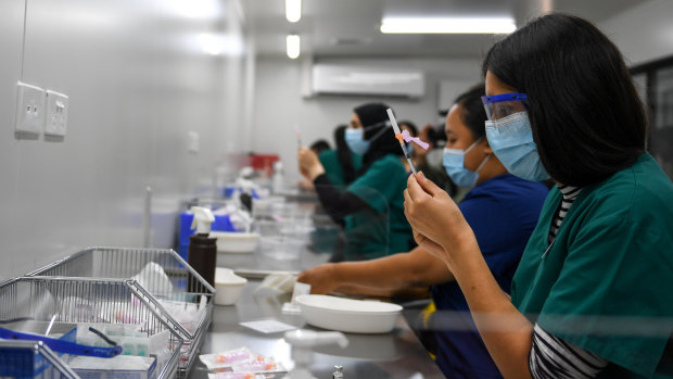 Pfizer vaccine doses being prepared at the Western Health Sunshine Hospital COVID-19 vaccination hub in March.