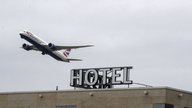 A plane passes over the Sofitel Hotel near London’s Heathrow.