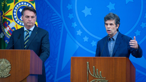 Brazilian President Jair Bolsonaro, left, with his new Health Minister Nelson Teich, after firing Teich's predecessor over disagreements on how to handle the epidemic.