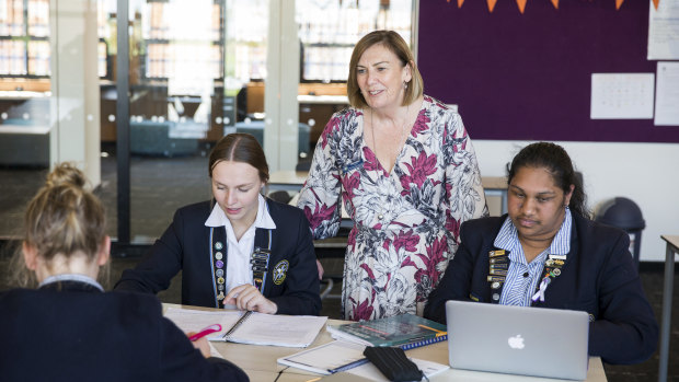 Mount St Joseph Girls' College principal Kate Dishon with senior students. The school was named the 2020 Schools that Excel winner for non-government schools in Melbourne's west. 